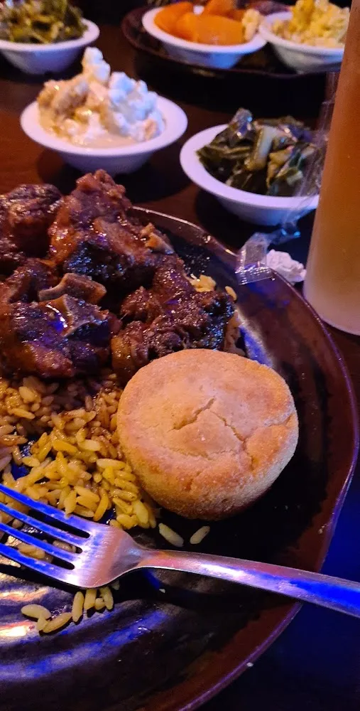 Oxtail and Rice with a Side of Collard Greens Mac and Cheese and Yams OH Yeah Banana Pudding Too